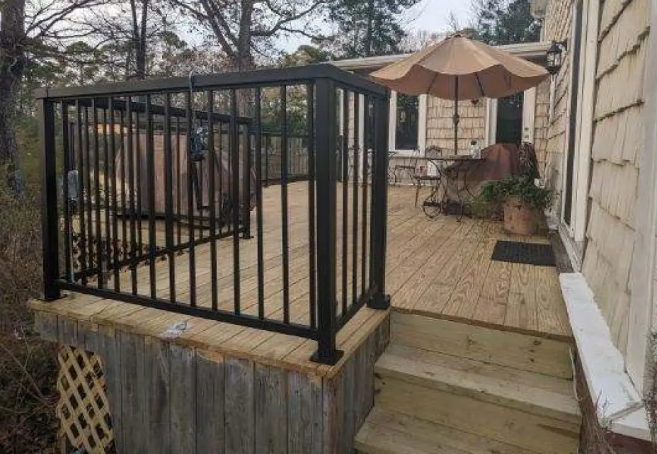 Outdoor deck with metal railing