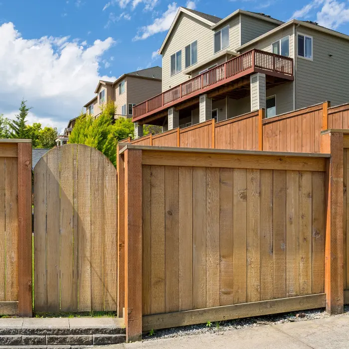 Wooden fence with residential houses