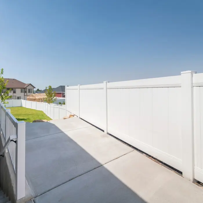 White vinyl privacy fence backyard