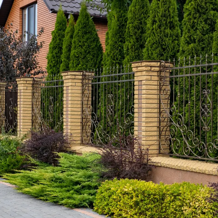 Brick fence with wrought iron