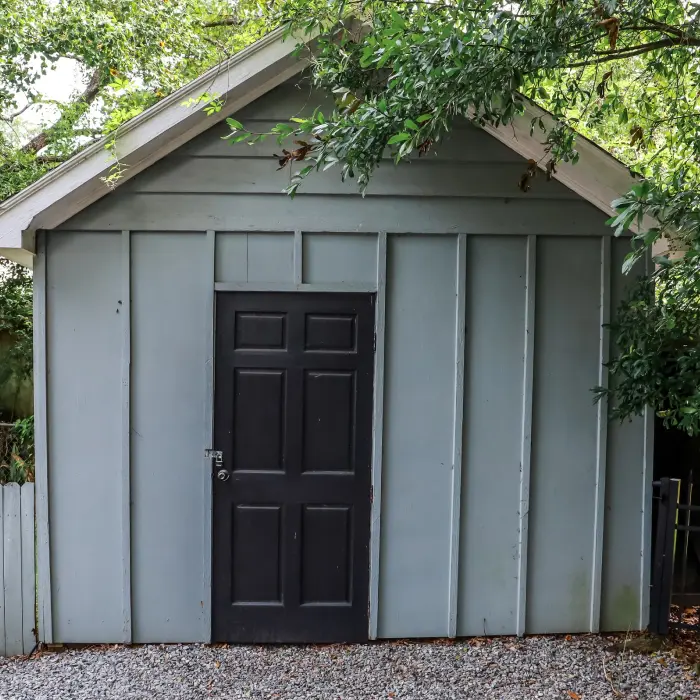 Outdoor storage shed with trees