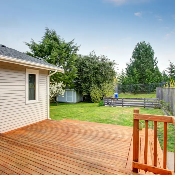 Backyard deck with lush greenery