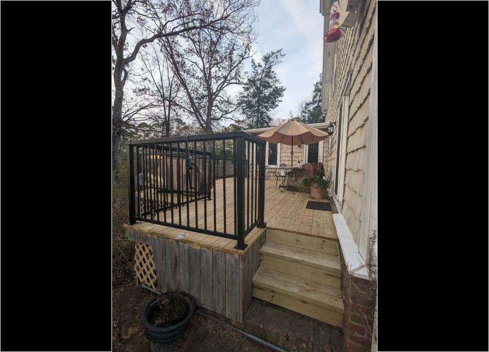 Wooden deck with metal railing