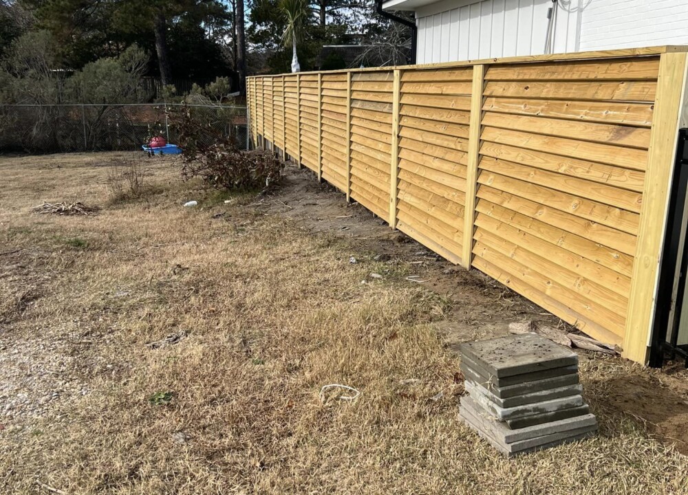 Wooden privacy fence backyard installation