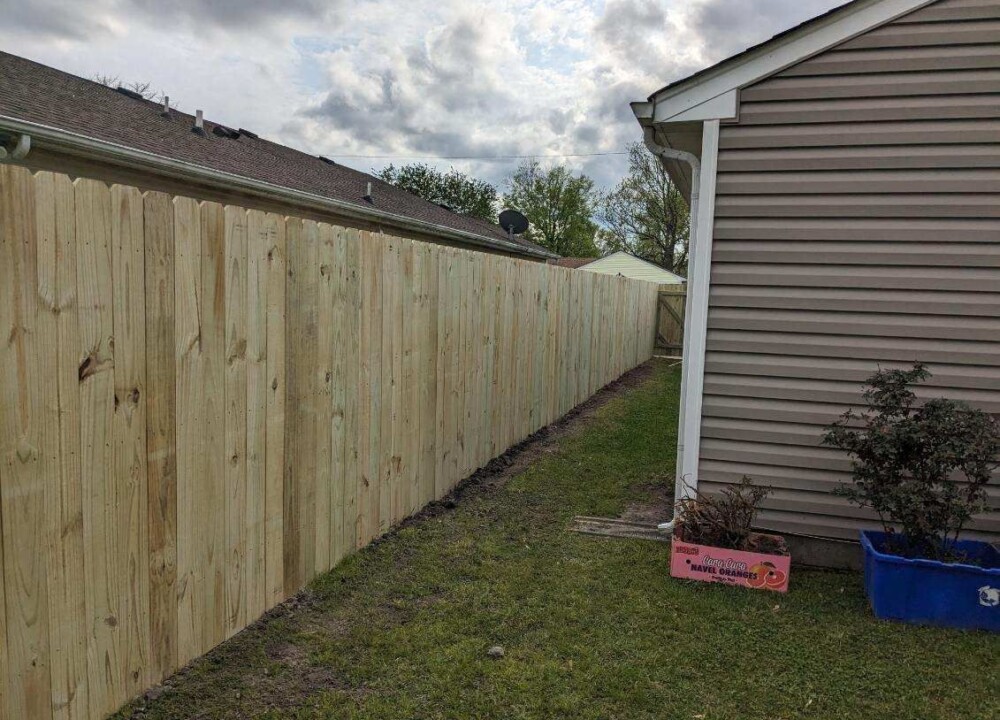 Wooden privacy fence backyard installation