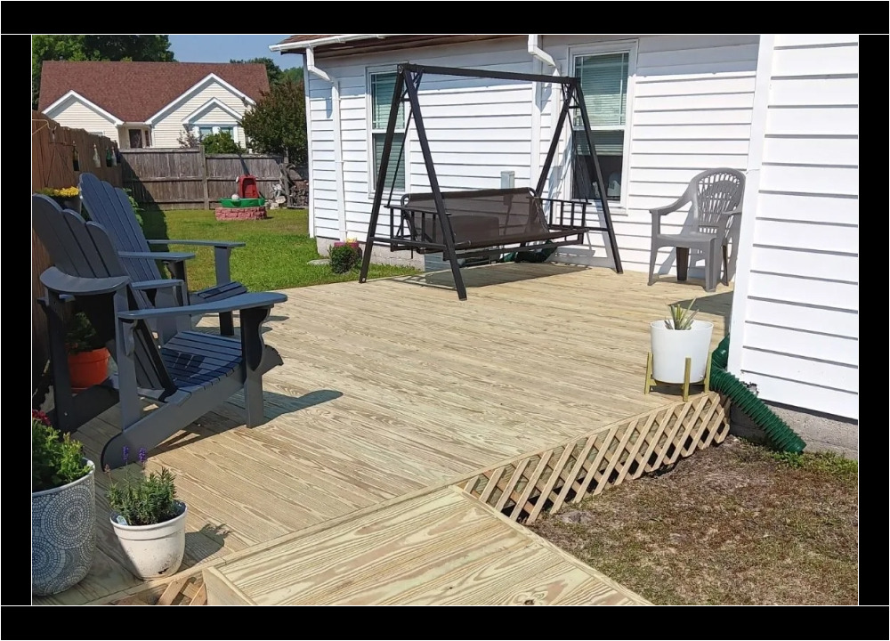 Backyard wooden deck with seating